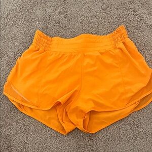 Lululemon orange 4in hotty hot shorts